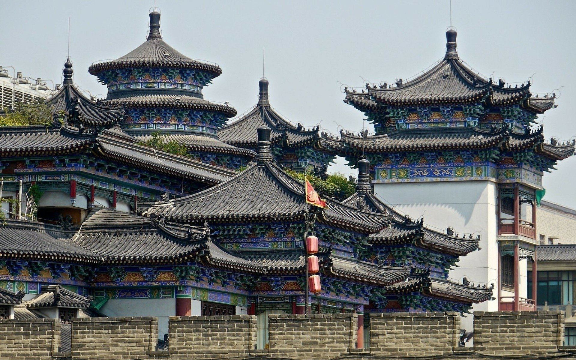 HD desktop wallpaper showcasing a traditional religious temple in Beijing, China, with intricate architectural details and colorful rooftops.