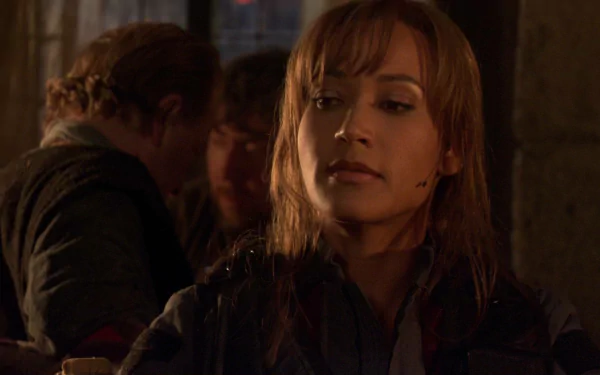 HD PC desktop wallpaper featuring Rachel Luttrell from the TV show Stargate Atlantis in a dimly lit scene.