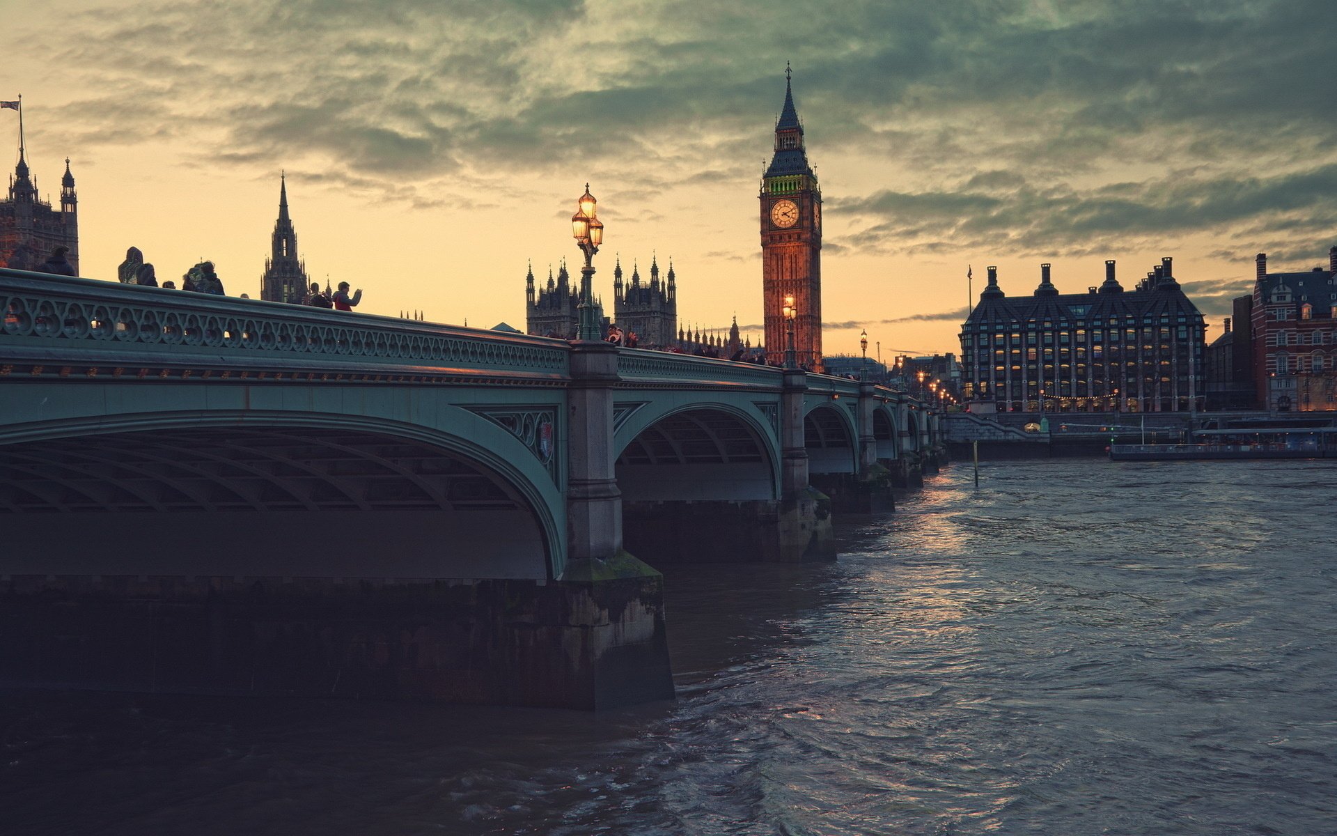 HD desktop wallpaper showcasing the iconic Big Ben and Westminster Bridge in London during a serene sunset over the River Thames.