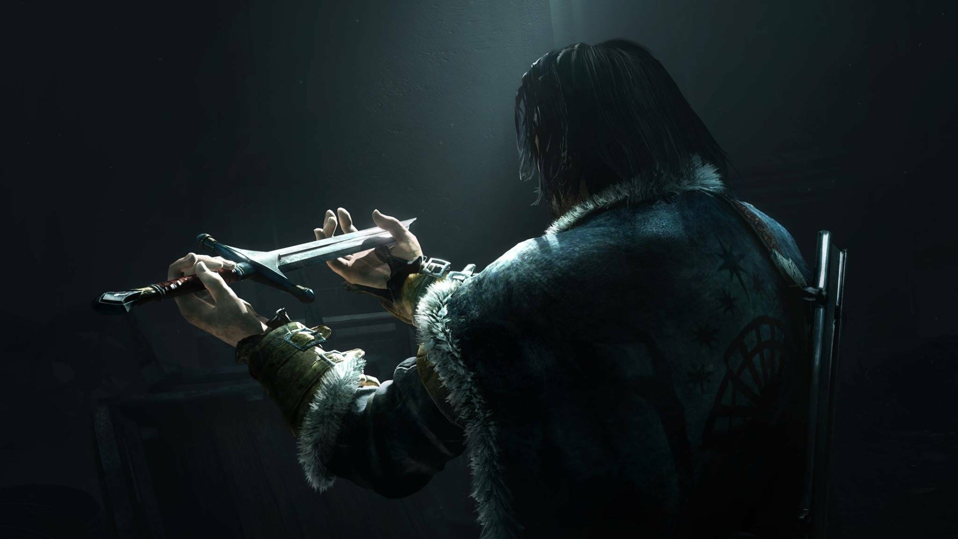HD PC desktop wallpaper from Middle-earth: Shadow of Mordor: a cloaked, long-haired ranger seen from behind under a shaft of light, gripping a narrow instrument with a sword on his back.