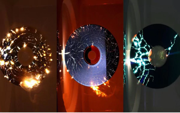 HD desktop wallpaper showing a triptych of vinyl records with different electrifying light effects against dark backgrounds.