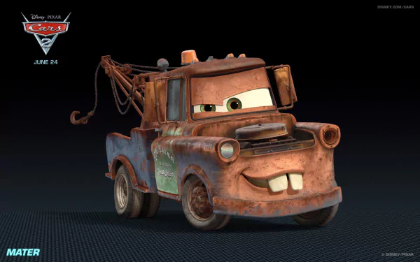 An HD wallpaper featuring Mater from Disney Pixar's Cars 2, showcasing his smiling face and iconic tow truck design against a dark background.