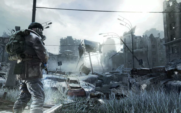 Video game HD PC desktop wallpaper and background — Metro Last Light Redux: lone armed survivor surveys a snowy, ruined cityscape beneath a pale sun.