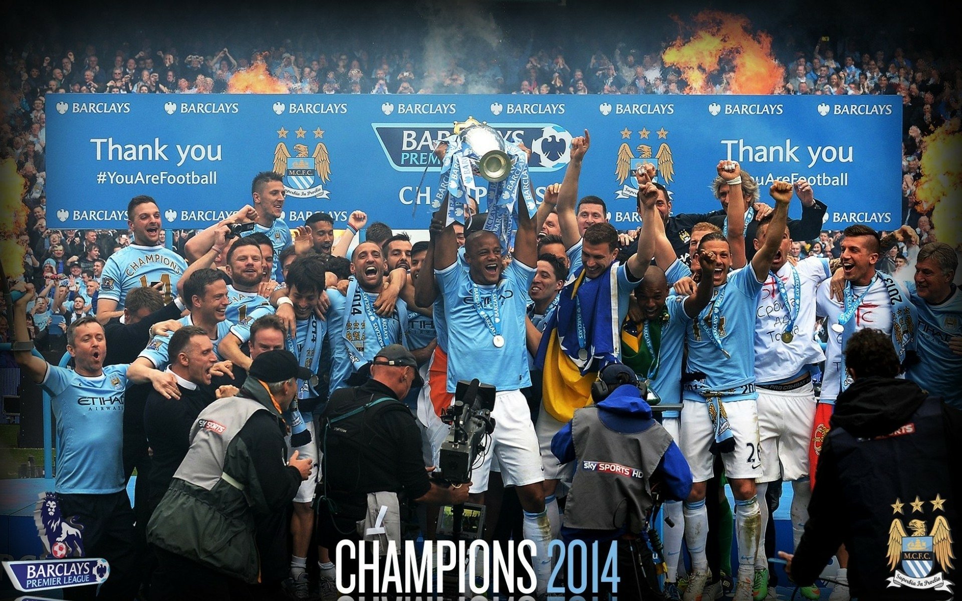 Manchester City F.C. players celebrate winning the 2014 Barclays Premier League title in this HD sports desktop wallpaper.