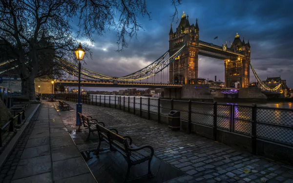 Night view of London's iconic Tower Bridge in England, captured as a high-definition PC desktop wallpaper showcasing the illuminated man-made structure over the river.