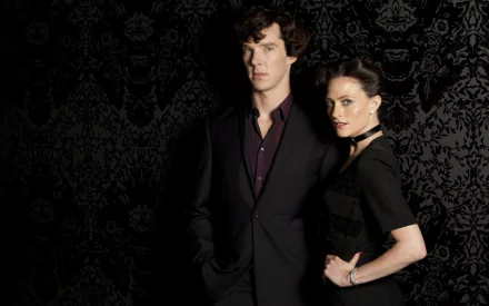 Benedict Cumberbatch as Sherlock Holmes stands beside Lara Pulver as Irene Adler, set against a dark, intricate background in a striking HD wallpaper from the TV series Sherlock.
