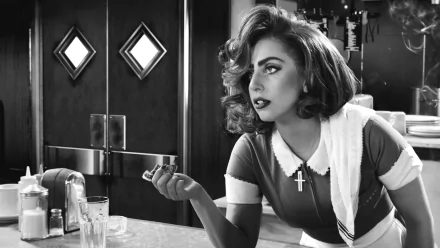 Monochrome HD wallpaper featuring Lady Gaga from the movie Sin City: A Dame to Kill For, capturing her striking pose and dramatic expression in black and white.