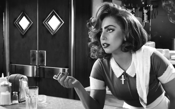 Monochrome HD wallpaper featuring Lady Gaga from the movie Sin City: A Dame to Kill For, capturing her striking pose and dramatic expression in black and white.