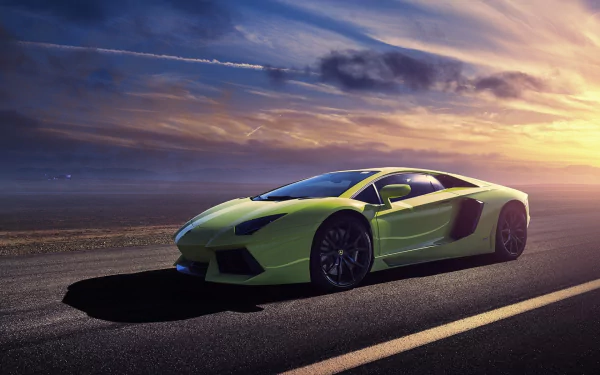 A vibrant green Lamborghini Aventador LP 700-4 parked on an open road, captured during a stunning sunset, showcasing its sleek design and supercar elegance.