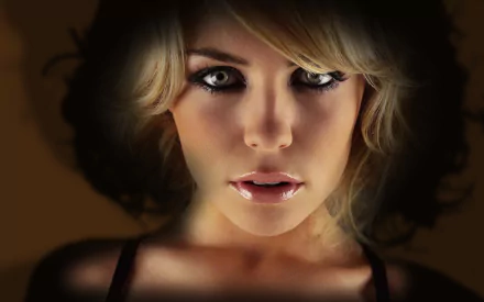 HD desktop wallpaper featuring a close-up of a woman's face with striking eyes and soft lighting against a dark background.