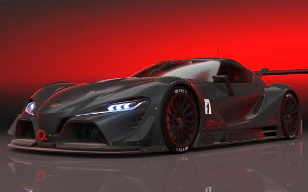 Sleek black Toyota FT-1 supercar concept with aggressive headlights set against a vibrant red background, shown as a high-definition PC desktop wallpaper.