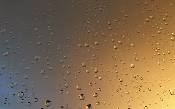 A close-up of water droplets on a surface, capturing intricate details against a softly blurred background. This 4K Ultra HD wallpaper enhances any desktop aesthetic.