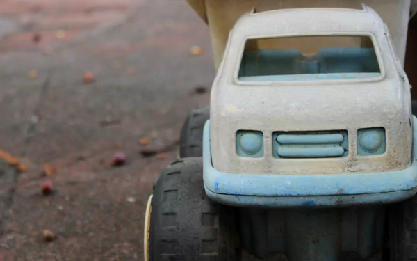 Close-up of the rear of an old toy car, with a vintage feel as HD desktop wallpaper.