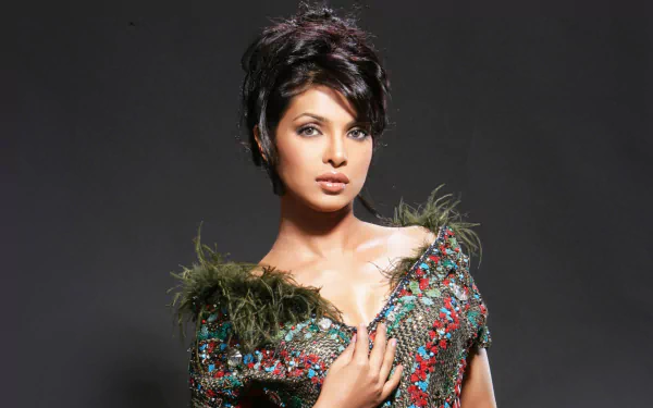 HD Bollywood desktop wallpaper featuring celebrity Priyanka Chopra in a stylish, textured outfit against a dark background.
