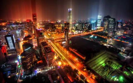 A stunning time-lapse view of Beijing's vibrant cityscape at night, featuring illuminated buildings and dynamic light trails, captured in 4K Ultra HD for a captivating desktop wallpaper.