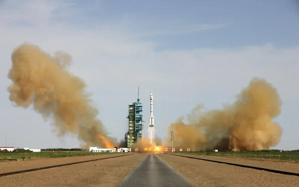 A stunning HD desktop wallpaper showcasing a rocket launching, surrounded by clouds of dust and smoke, highlighting the impressive feat of man-made technology in action.