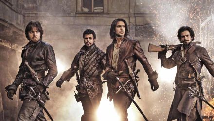 HD PC desktop wallpaper of four leather-clad musketeers from the TV show The Musketeers, swords drawn, striding through a smoky, dramatic background.