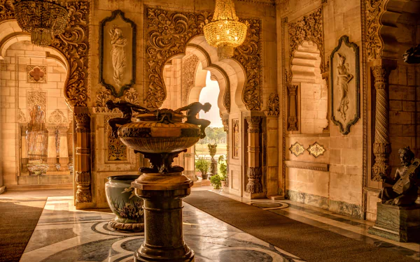 Interior view of the ornate Laxmi Vilas Palace in Vadodara, showcasing intricate architecture and warm lighting in high definition.