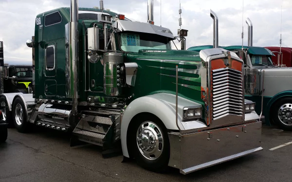 A green Kenworth truck parked with chrome details, captured in 4K Ultra HD as a PC desktop wallpaper background.