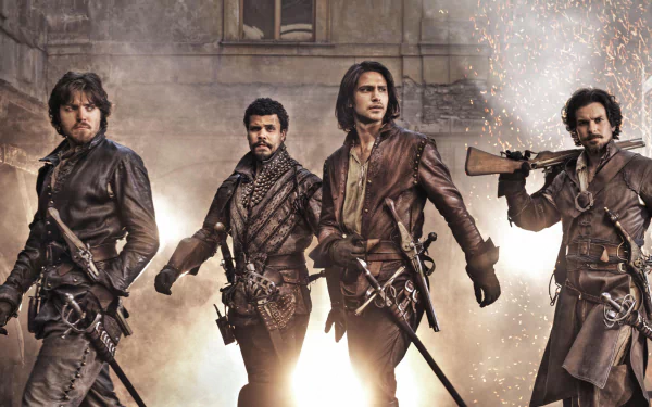 HD PC desktop wallpaper of four leather-clad musketeers from the TV show The Musketeers, swords drawn, striding through a smoky, dramatic background.