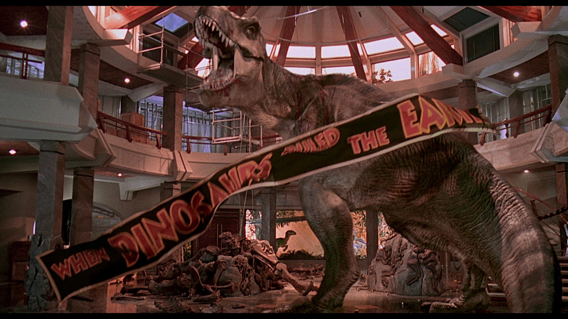 HD desktop wallpaper from Jurassic Park featuring a T-Rex in the visitor center causing destruction.