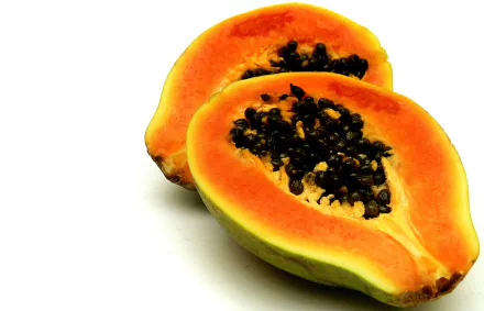 Halved papaya (pawpaw) showing bright orange flesh and glossy black seeds against a white background, HD PC desktop wallpaper and food background.