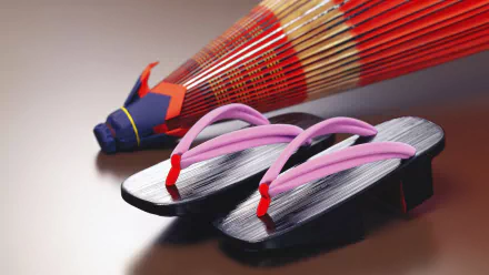 HD desktop wallpaper features traditional Japanese geta sandals paired with a vibrant red oriental umbrella, capturing classic elements of Japanese culture and photography.