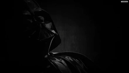 Dark HD PC desktop wallpaper of Darth Vader in shadow — iconic Star Wars sci‑fi villain in glossy black helmet and cape against a textured black background.
