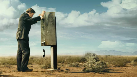 HD wallpaper featuring Bob Odenkirk as Jimmy McGill from Better Call Saul, leaning on a payphone in the desert.
