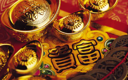 HD desktop wallpaper showcasing traditional Chinese New Year gold ingots and red decorations symbolizing wealth and prosperity during the holiday celebration.