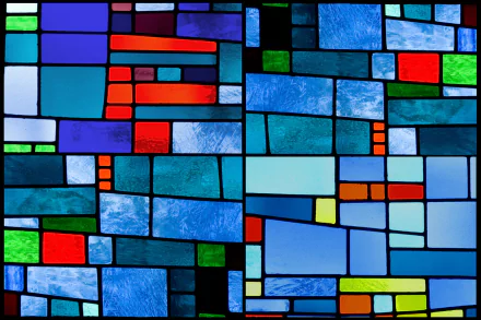 HD PC desktop wallpaper featuring an artistic stained glass design with vibrant blue, red, green, and yellow geometric shapes.