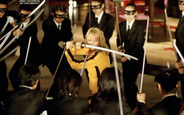 HD PC desktop wallpaper featuring a dramatic scene from the movie Kill Bill: Vol. 1 with Uma Thurman wielding a katana surrounded by adversaries.
