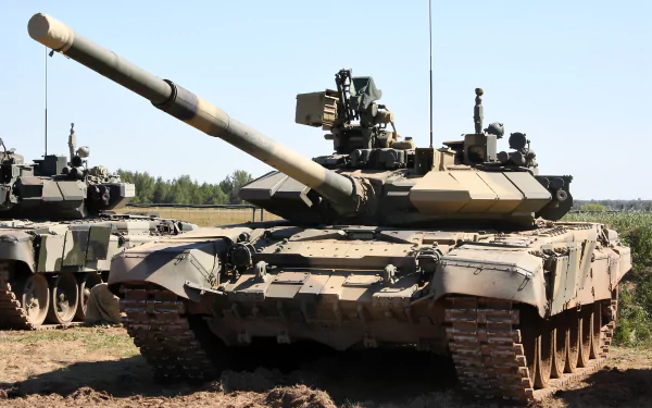 HD PC desktop wallpaper featuring a T-90 military tank positioned in an open field under a clear sky.