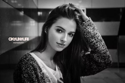 Black and white vintage-style HD desktop wallpaper featuring a smiling woman with long hair, captured in a monochrome close-up portrait.