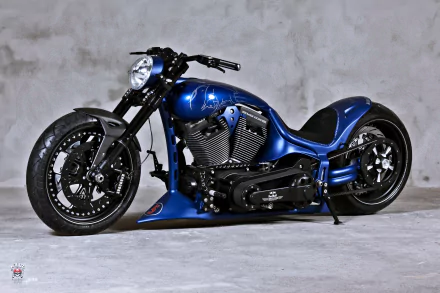 A sleek blue Harley-Davidson motorcycle against a grey background, featured as an HD desktop wallpaper.