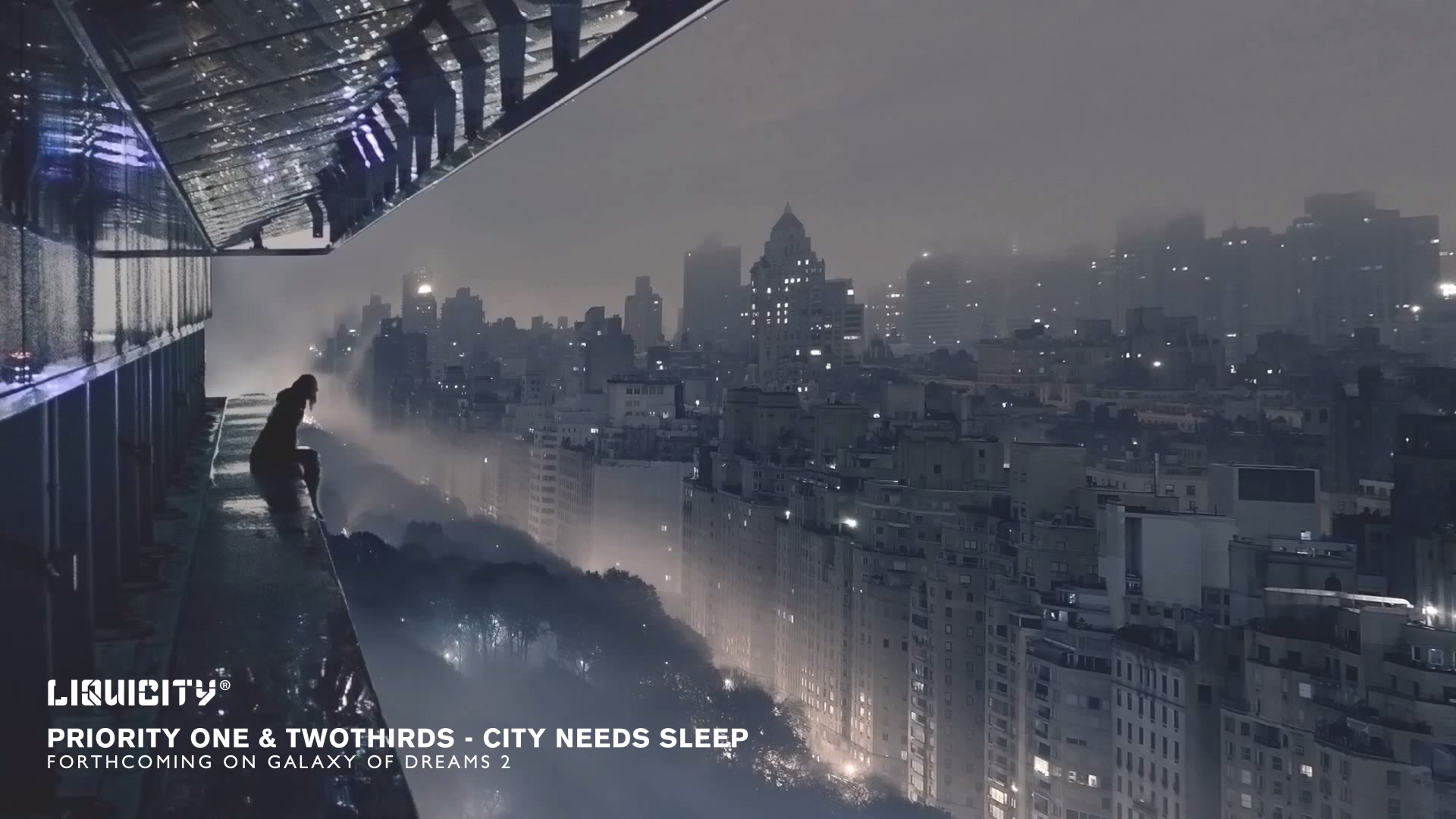 HD PC desktop wallpaper featuring a misty cityscape at night with a solitary figure on a balcony, evoking a calm, music-inspired atmosphere by Liquicity.