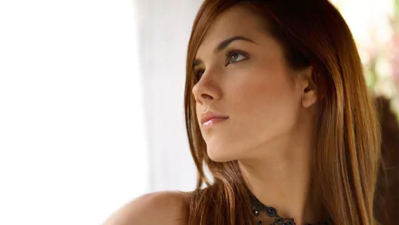 HD desktop wallpaper featuring a close-up portrait of model Roberta Murgo, showcasing her thoughtful expression and natural beauty.