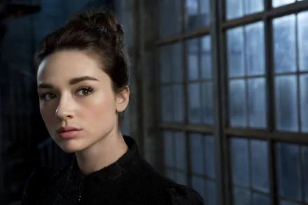 Crystal Reed as Allison Argent, captured in a striking HD desktop wallpaper. The image features her contemplative gaze against a backdrop of large, moody windows.