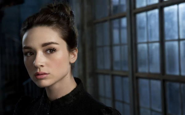 Crystal Reed as Allison Argent, captured in a striking HD desktop wallpaper. The image features her contemplative gaze against a backdrop of large, moody windows.