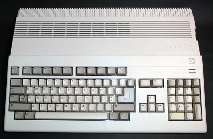 HD desktop wallpaper featuring a close-up of a vintage Commodore Amiga computer keyboard, highlighting classic technology design.