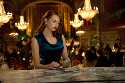 HD PC desktop wallpaper featuring Emma Stone in a scene from the movie Gangster Squad, dressed elegantly in a dark blue dress with vintage chandelier lighting in the background.