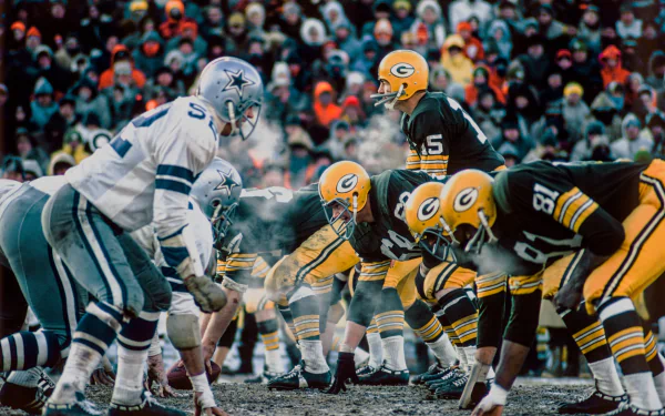 HD PC desktop wallpaper showcasing a heated moment in a football game between two teams lined up on the field, capturing the intensity of the sport.