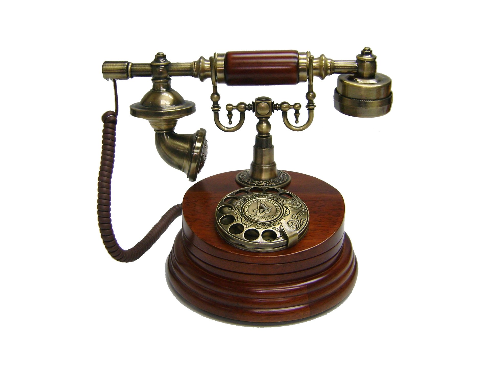 Antique wooden rotary dial telephone with brass accents, showcasing vintage technology on a clean white background, designed as an HD PC desktop wallpaper.