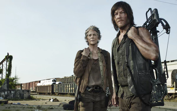 A high-definition wallpaper from the TV show The Walking Dead, featuring two main characters standing in a desolate landscape with abandoned train cars in the background.
