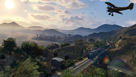A stunning HD wallpaper from Grand Theft Auto V, featuring a picturesque landscape with mountains, a train on the tracks, and a plane soaring overhead against a vibrant sky.
