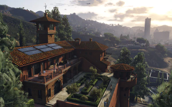 A high-definition Grand Theft Auto V desktop wallpaper featuring a scenic view of a luxurious mansion and surrounding landscape at sunset.