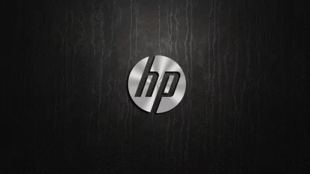 HD desktop wallpaper featuring a sleek, metallic Hewlett-Packard (HP) logo on a dark textured background, highlighting technology and modern design.