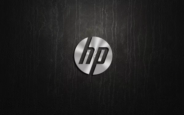 HD desktop wallpaper featuring a sleek, metallic Hewlett-Packard (HP) logo on a dark textured background, highlighting technology and modern design.