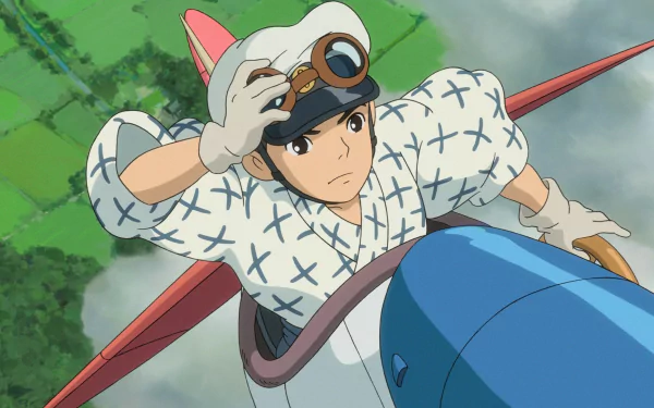 HD desktop wallpaper featuring a character from The Wind Rises riding an airplane with a pilot's cap and goggles.