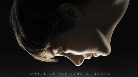 Close-up side profile of a person against dark background with the phrase THERE IS HOPE INSIDE US ALL in this 4K Ultra HD PC desktop wallpaper inspired by the movie Insurgent.